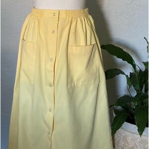 Sears vintage yellow apron style pleaded skirt with two front pockets.